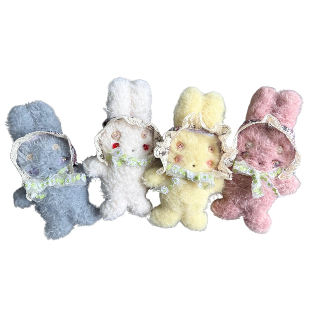 Set of five pastel bunny plush dolls with lace bonnets and daisy ribbon – handmade vintage-style toys from Mimi Planet in pink, blue, white, yellow and peach.”