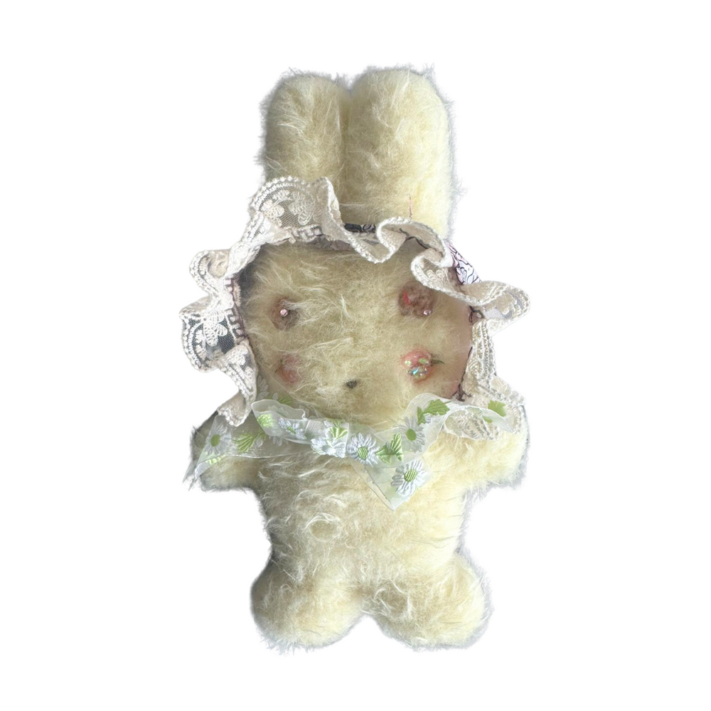 “Hand-sewn pastel yellow bunny plush with floral bonnet and soft fluffy texture – whimsical collectible toy by Mimi Planet.”