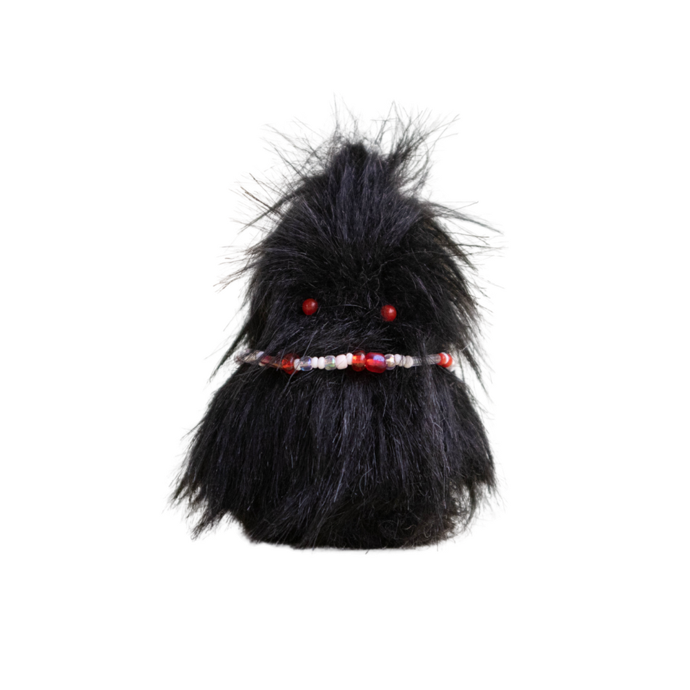Handmade black fluffy plush creature with red beaded belt – Daawe Baby from Mimi Planet, edgy and collectible soft toy from Hong Kong.”