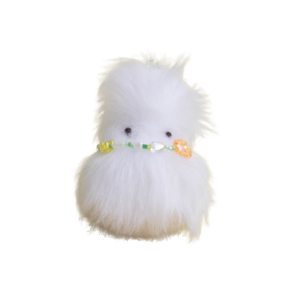White fluffy handmade plush creature with pastel green and yellow beaded flower belt – Daawe Baby by Mimi Planet, cute collectible toy