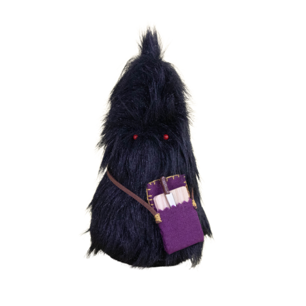 Black Daawe plush with red eyes, scroll pouch, and mystic vibe – food hunter or scholar collectible plush from Mimi Planet
