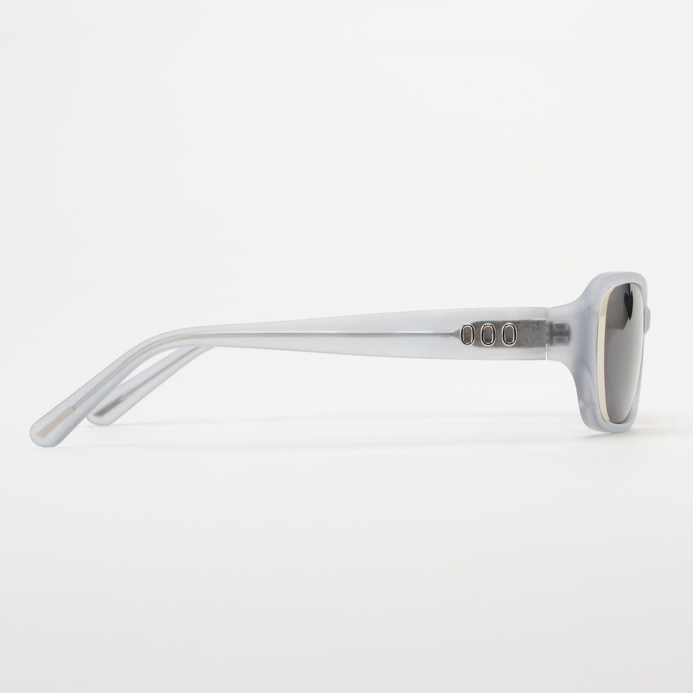 Sunglasses with a clear frame and dark lenses on a white background