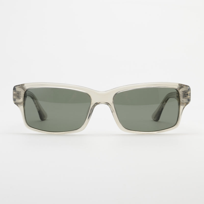 Sunglasses with clear frame and dark lenses on a white background