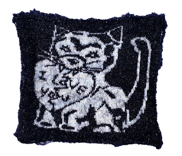 Knitted design detail with a cat, on a t-shirt in white background 