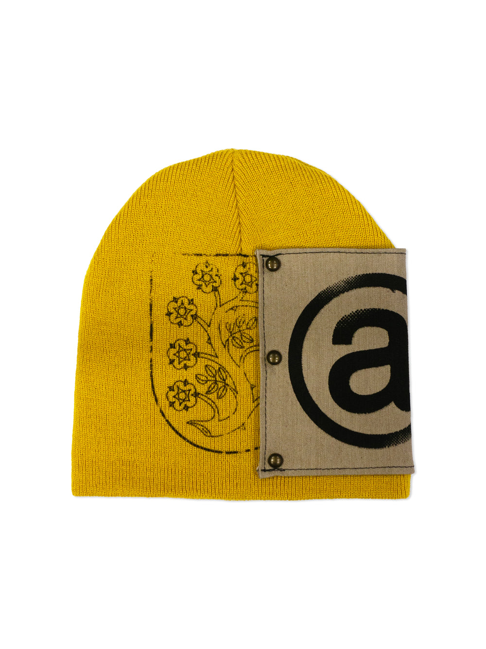 Yellow beanie with a patch featuring a '@' symbol and floral design on a white background
