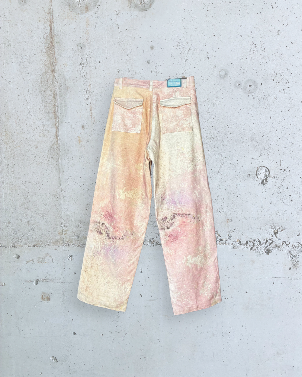 Back view of Foresight BARREL PANTS PINK by Tellavision with wide barrel leg silhouette and rear patch pockets.