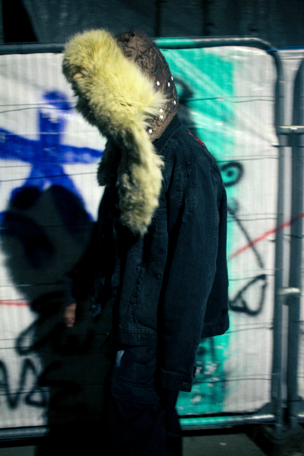 Detachable fur hood scarf worn from side, showing hood shape and fur length