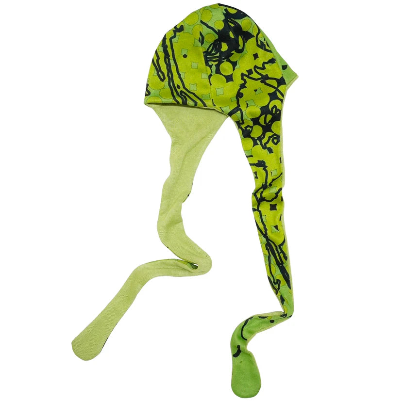 Green and black patterned dog coat on a white background