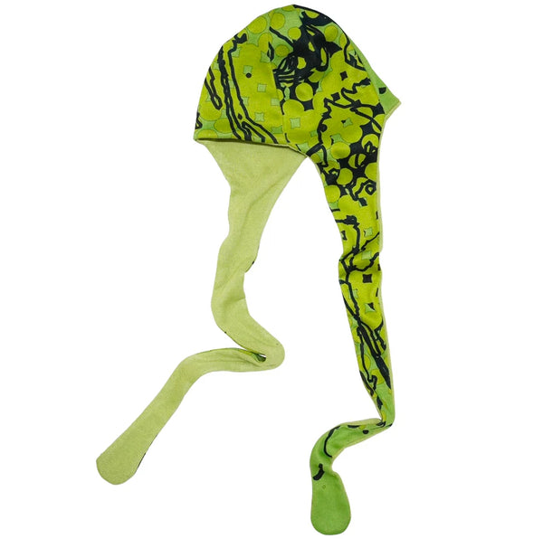 Green and black patterned dog coat on a white background
