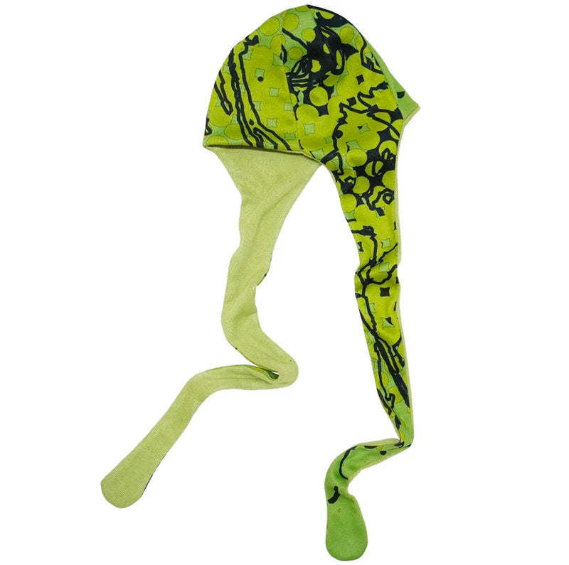 Green and black patterned dog coat on a white background