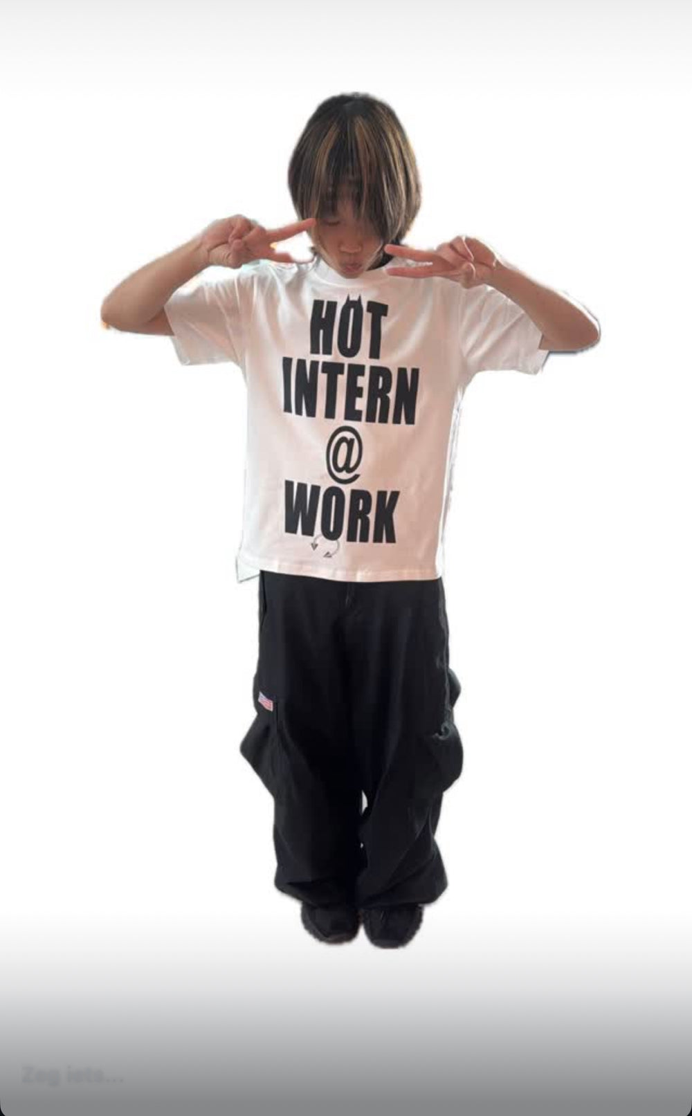 Person wearing a white t-shirt with 'HOT INTERN @ WORK' text on a white background