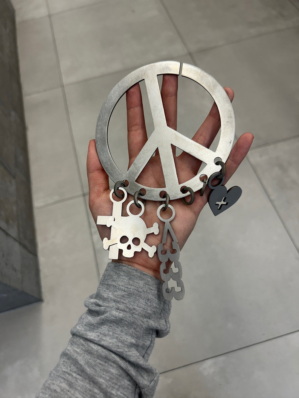 Limited Edition Drops Emoticon Keyring held in hand