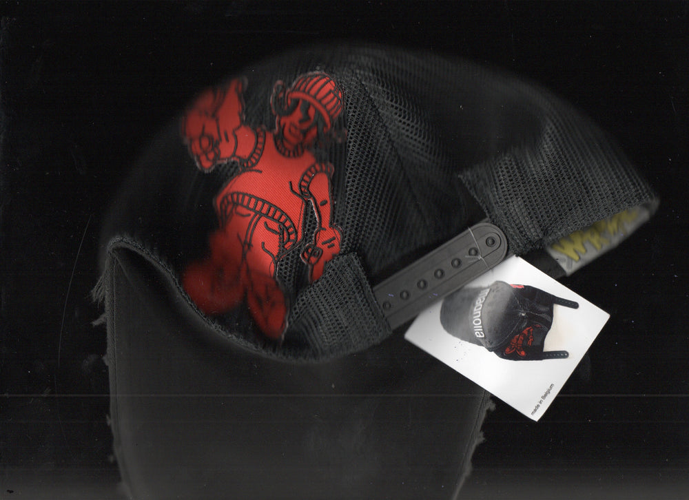 Black mesh baseball cap with red graphic print, snapback closure, and branded hang tag shown in close-up detail.