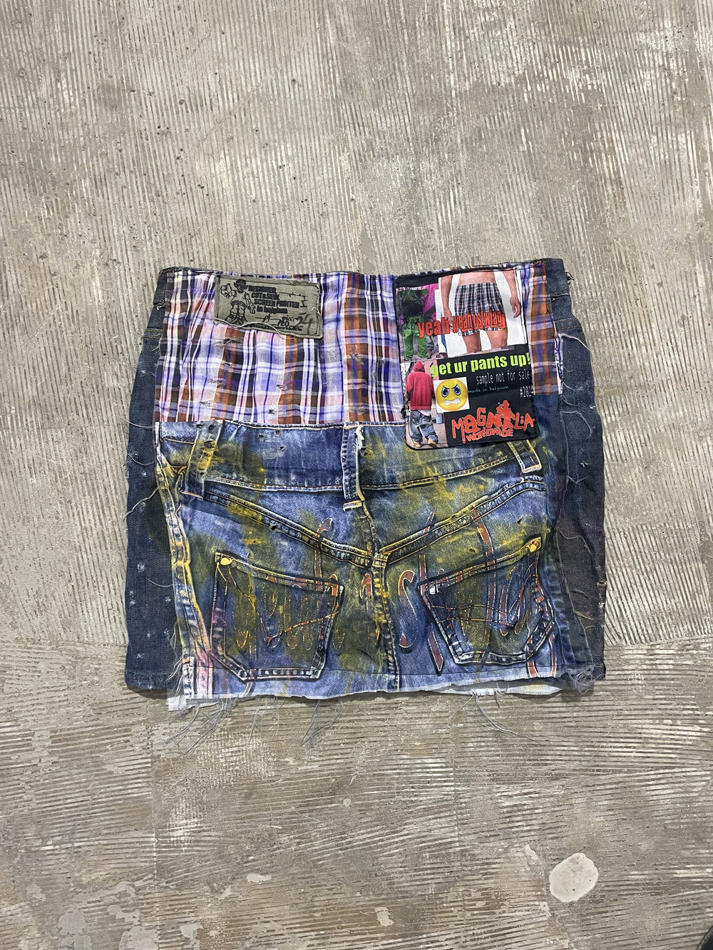 Dream Unit S(w)AG Skirt flat lay back view with upcycled patchwork denim and raw hem.