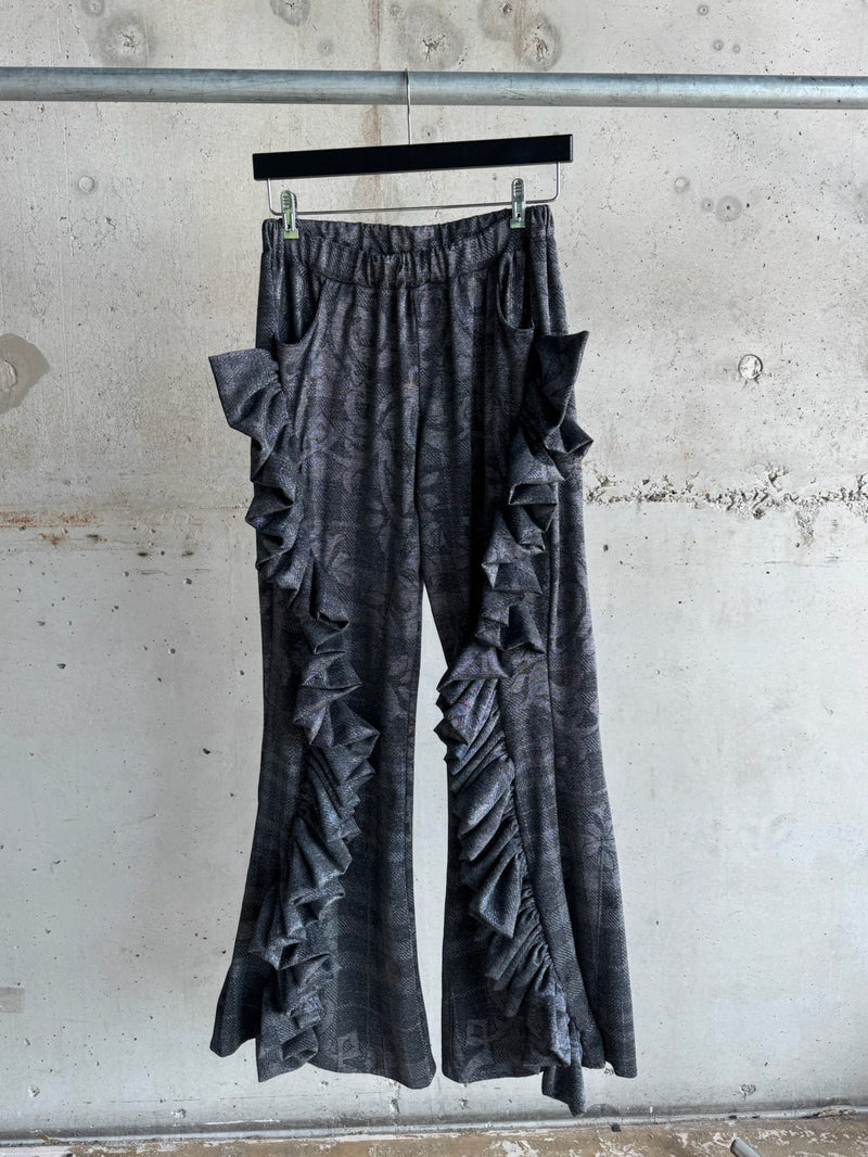 Charcoal grey ruffle wide-leg pants with textured pattern and elastic waistband, featuring dramatic cascading side ruffles – handmade statement trousers for bold fashion lovers, size S/M