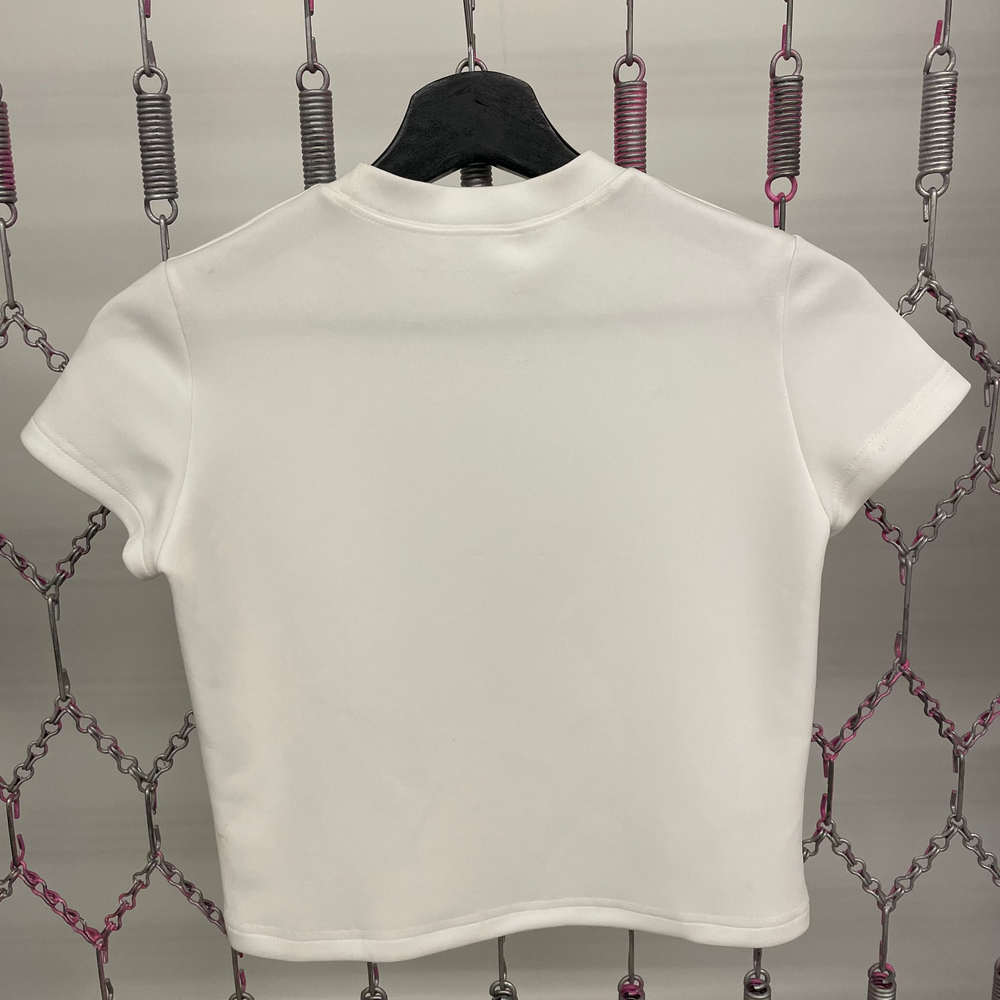 White t-shirt on a hanger against a decorative chain background