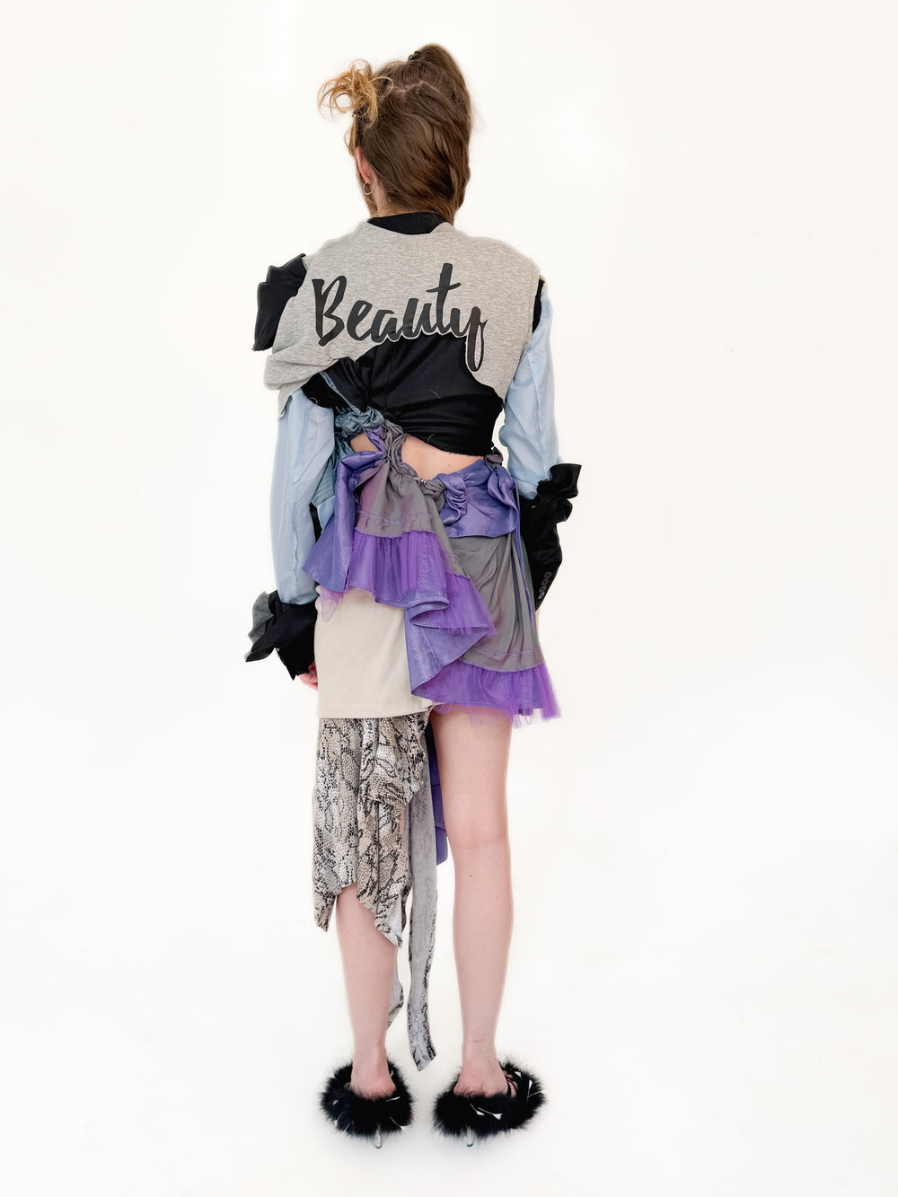 Person wearing a layered outfit with text on a white background