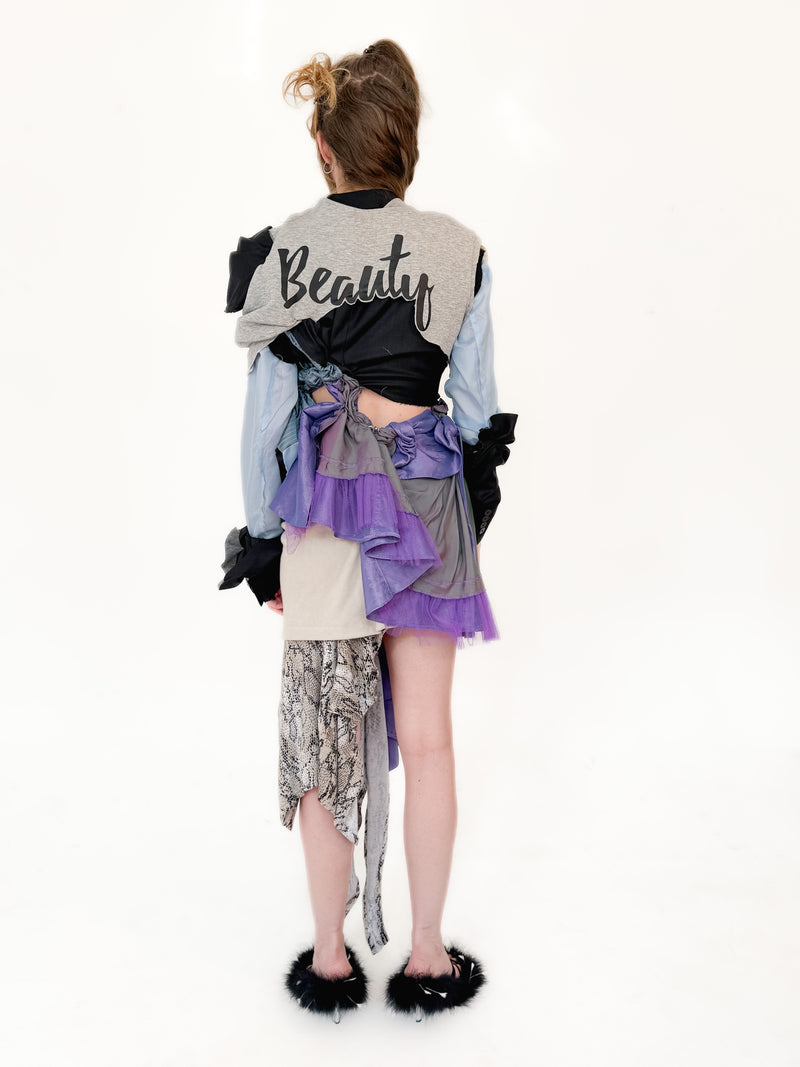 Person wearing a layered outfit with text on a white background