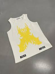 White tank top with yellow graphic and text on a gray background