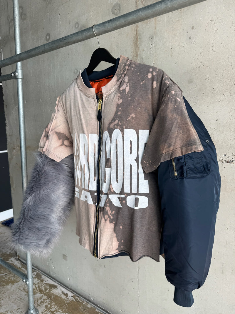 Avant-garde patchwork jacket featuring a bleached ‘HARDCORE’ graphic T-shirt front, asymmetrical zip closure, one faux fur sleeve, and one navy bomber jacket sleeve – experimental unisex design with bold streetwear and deconstructed elements
