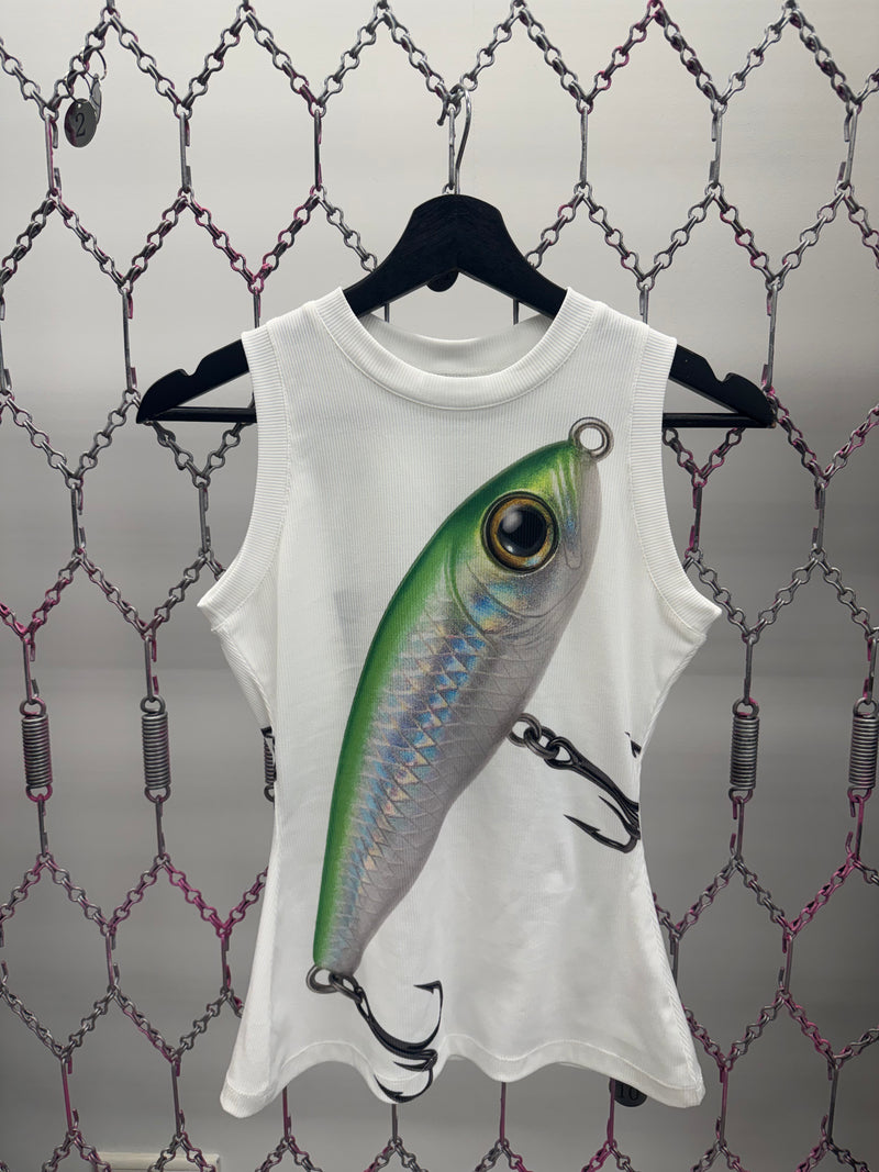 White sleeveless shirt with a fishing lure design on a chain-link fence background