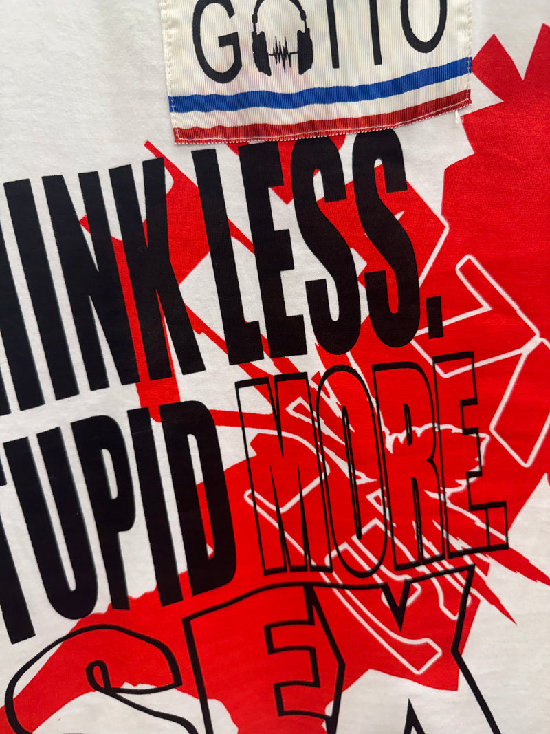 Textured fabric with 'Think Less, Stupid More' printed on it