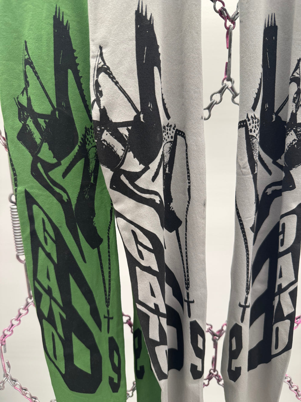 Green and white ski with black graphics and branding on a light background