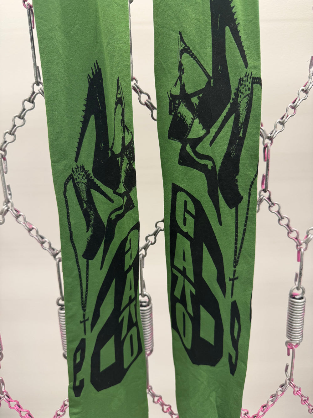 Green skis with black graphics and 'Gasko' branding on a white background.