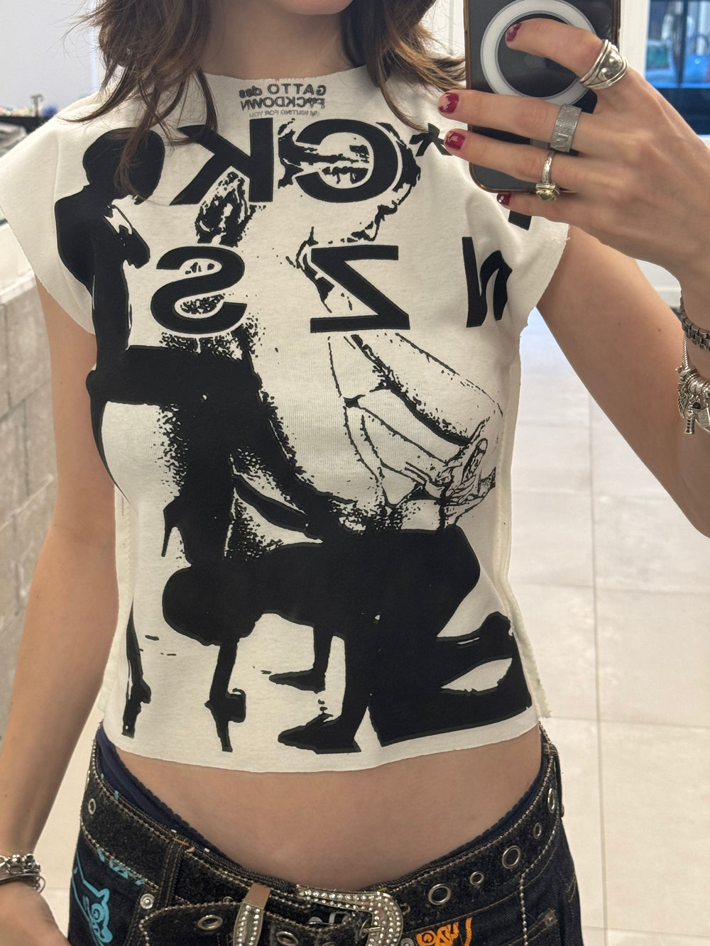 Person wearing a graphic t-shirt with black and white design