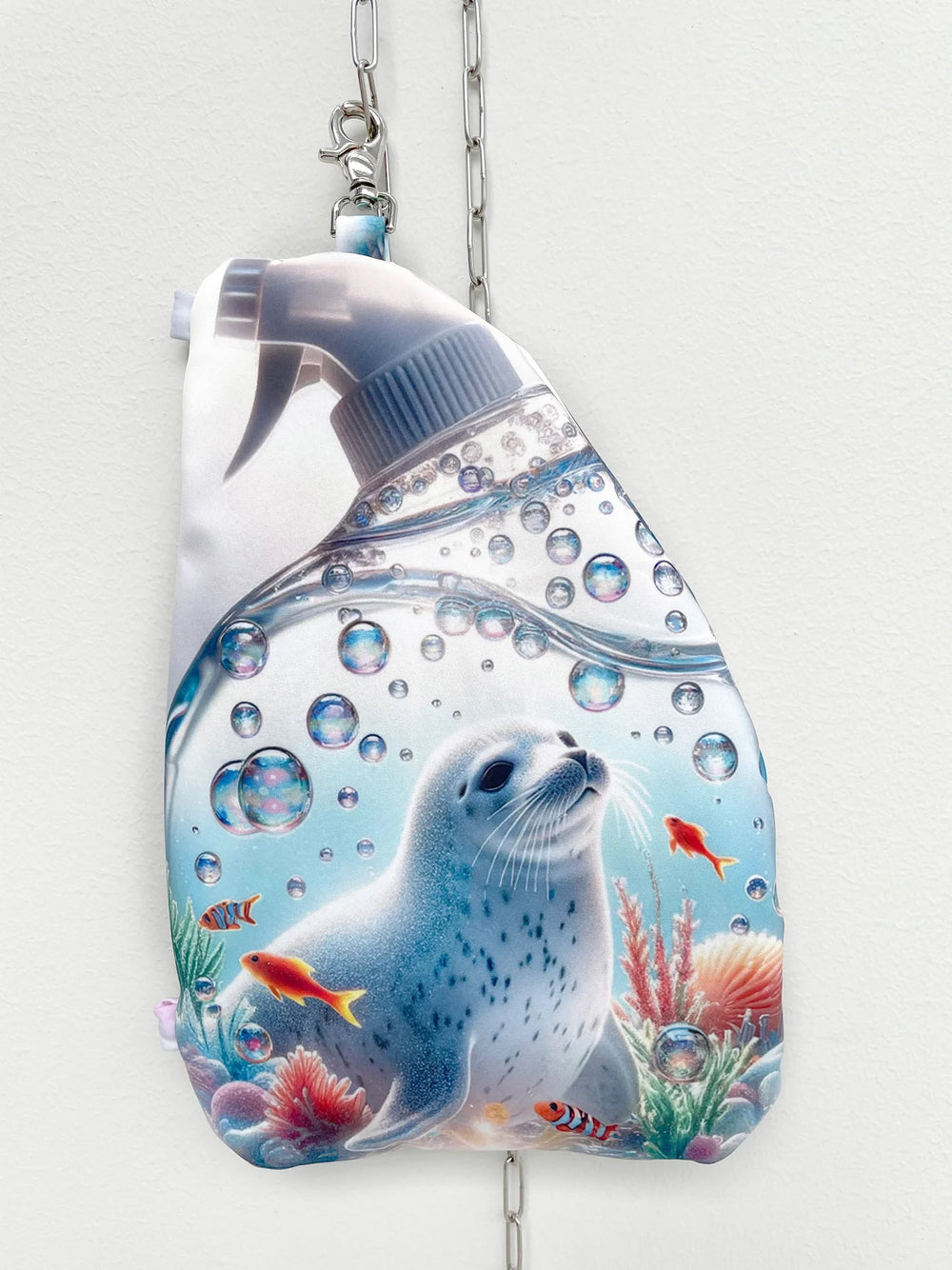Reusable water bottle with a seal and fish design on a white background