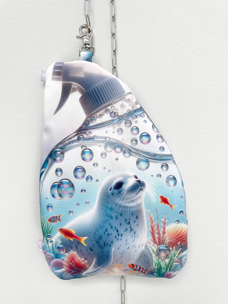 Reusable water bottle with a seal and fish design on a white background
