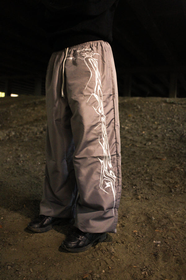 Grey Tribs tribal track pants front view by Atelier mo6 – Dream Unit Amsterdam