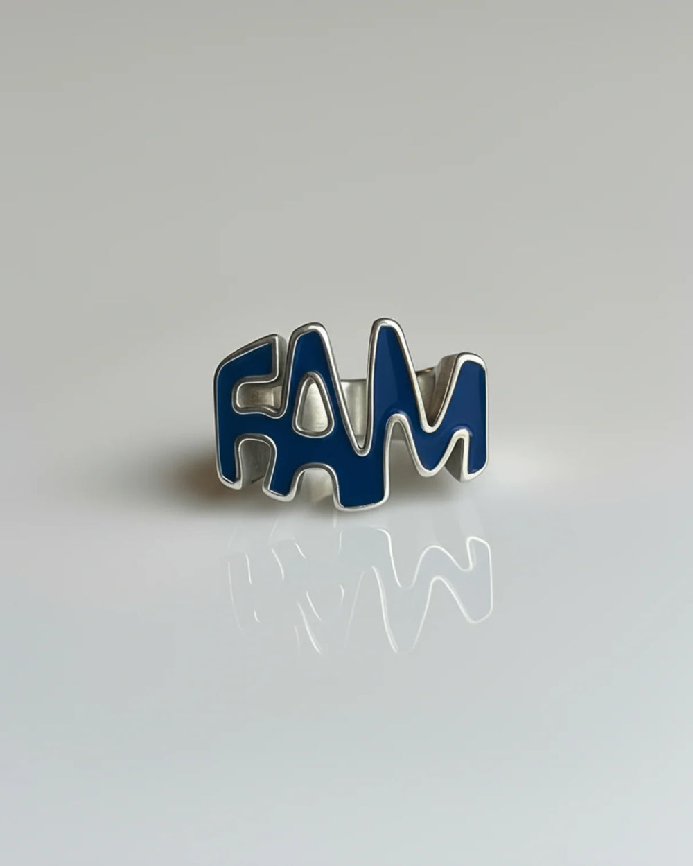 Blue 'FAM' ring on a light gray background
