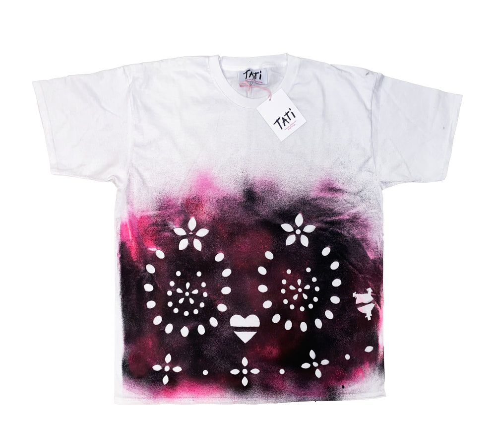 White t-shirt with black and pink tie-dye design and white patterns on a white background