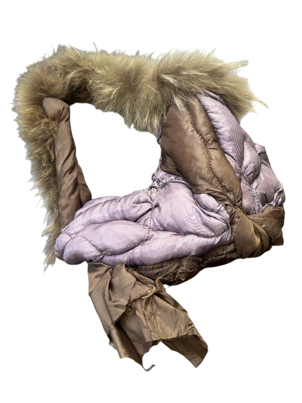 Folded purple puffer handbag with fur trim on a wooden floor