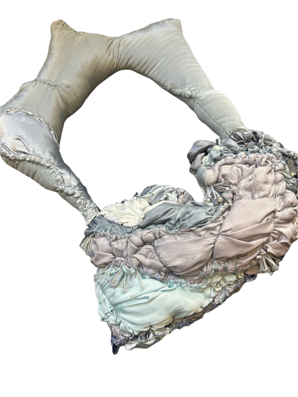 Decorative bag with ruffled edges on a wooden surface