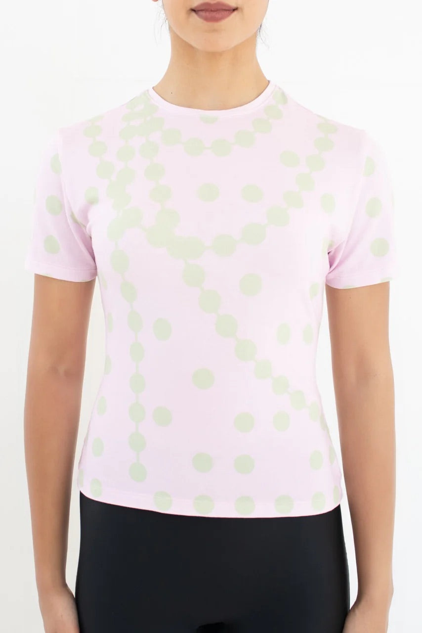 Front view of the GYGIL pink and green polkadot short-sleeve t-shirt.
