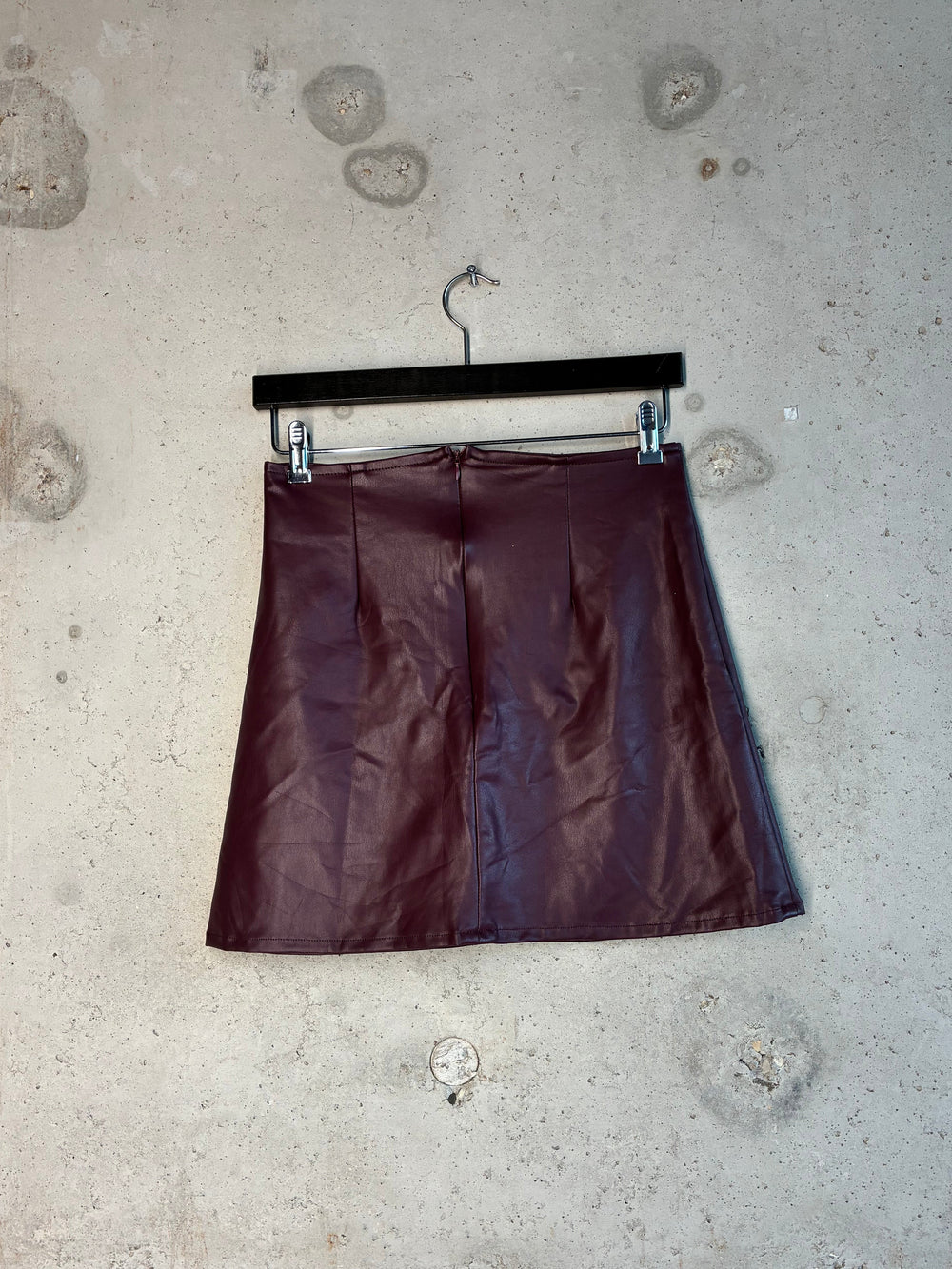Back view of burgundy Tellavision Desire Leather Skirt in faux leather