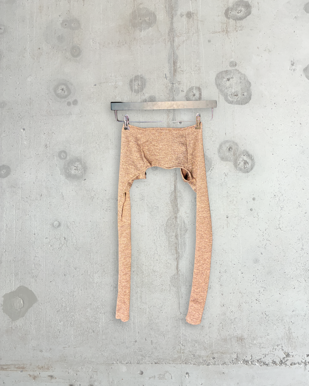 Back view of beige melange Tellavision arm warmer bolero with elongated sleeves