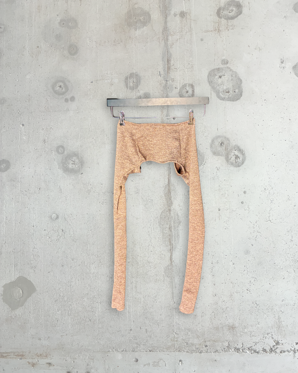 Back view of beige melange Tellavision arm warmer bolero with elongated sleeves