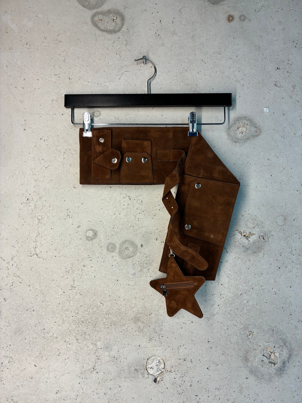Brown suede Tellavision u.s.b. belt with detachable pocket details.