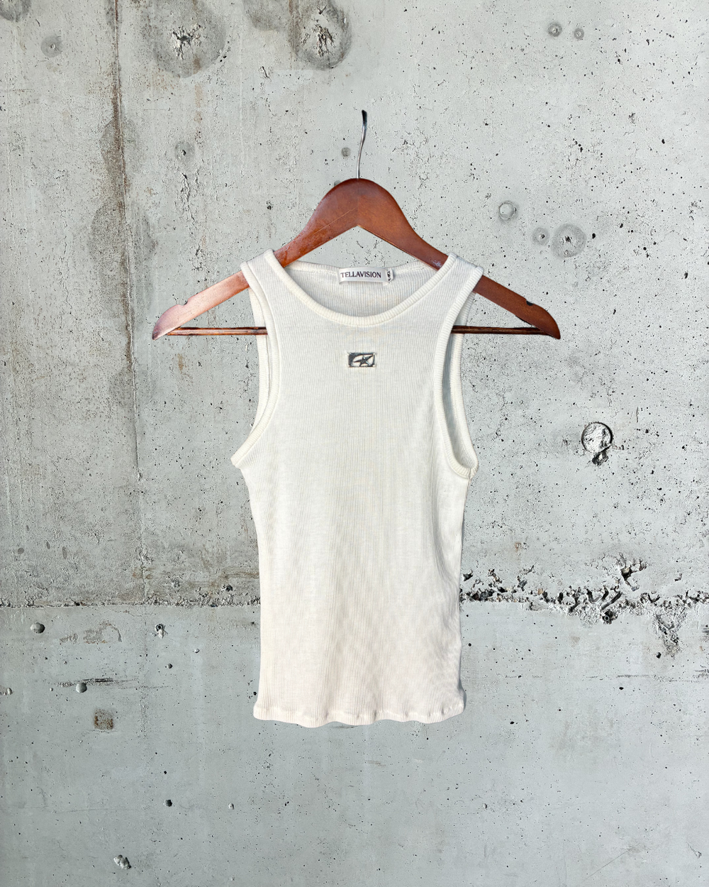 Cream ribbed Tellavision Wishes Tank with metal logo detail