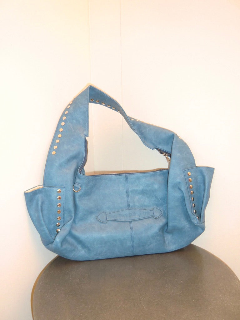 Blue handbag with studs on a white background